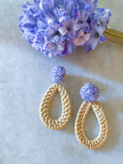 Ava Lavender Rattan earring displayed with purple floral_m donohue collection