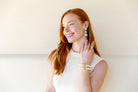 Model wears Grace Pearl Rattan drop earring_m donohue collection