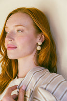Model wears Grace Mini Rattan Ball earring_m donohue collection