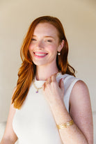 Model wears the Bloom Pearl Hook earring_m donohue collection